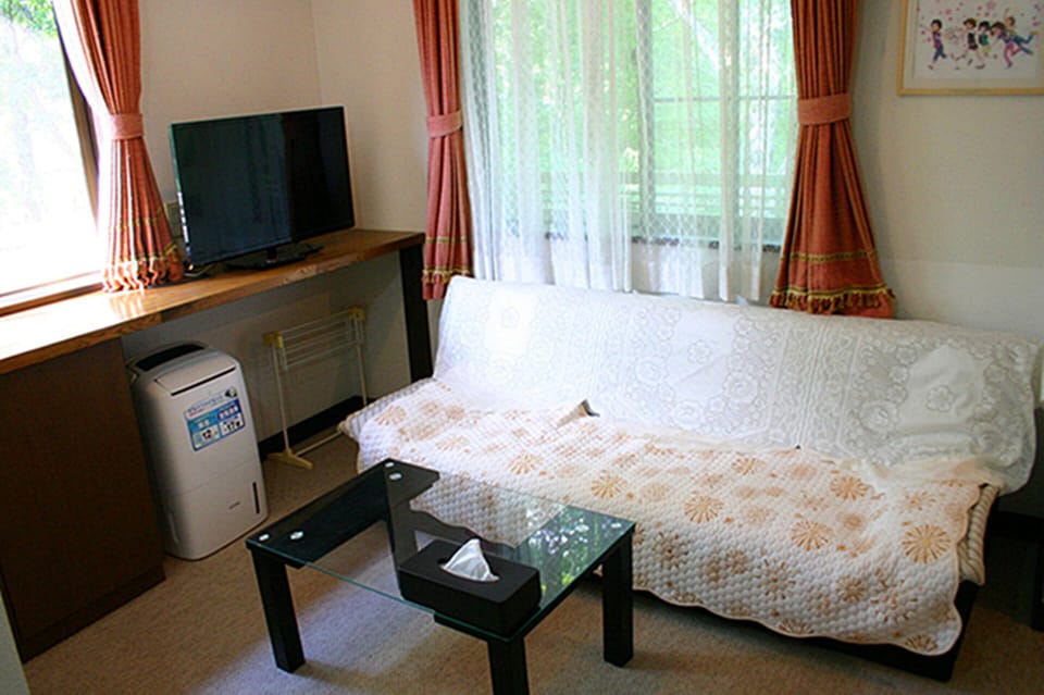 Family Quadruple Room, Multiple Beds, Non Smoking, Lake View | Down comforters, minibar, desk, laptop workspace