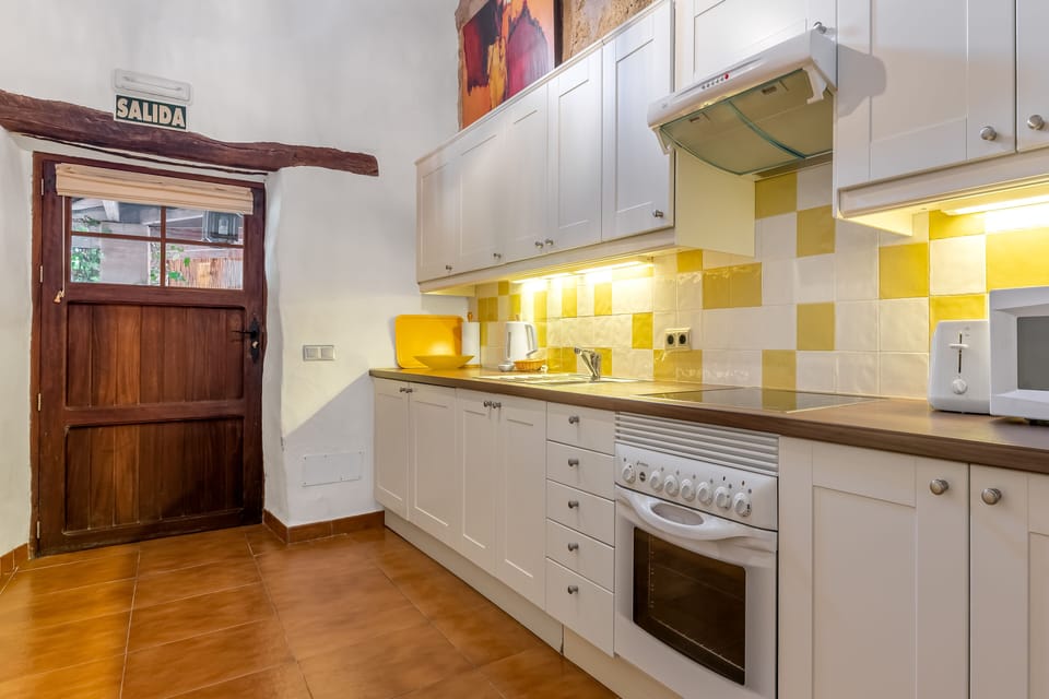 Apartment Tierra | Private kitchen | Full-size fridge, microwave, oven, stovetop
