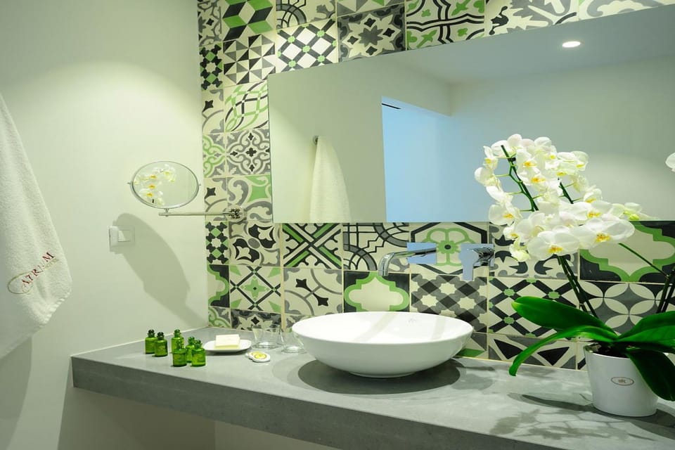 Superior Room, Pool View | Bathroom | Designer toiletries, hair dryer, towels