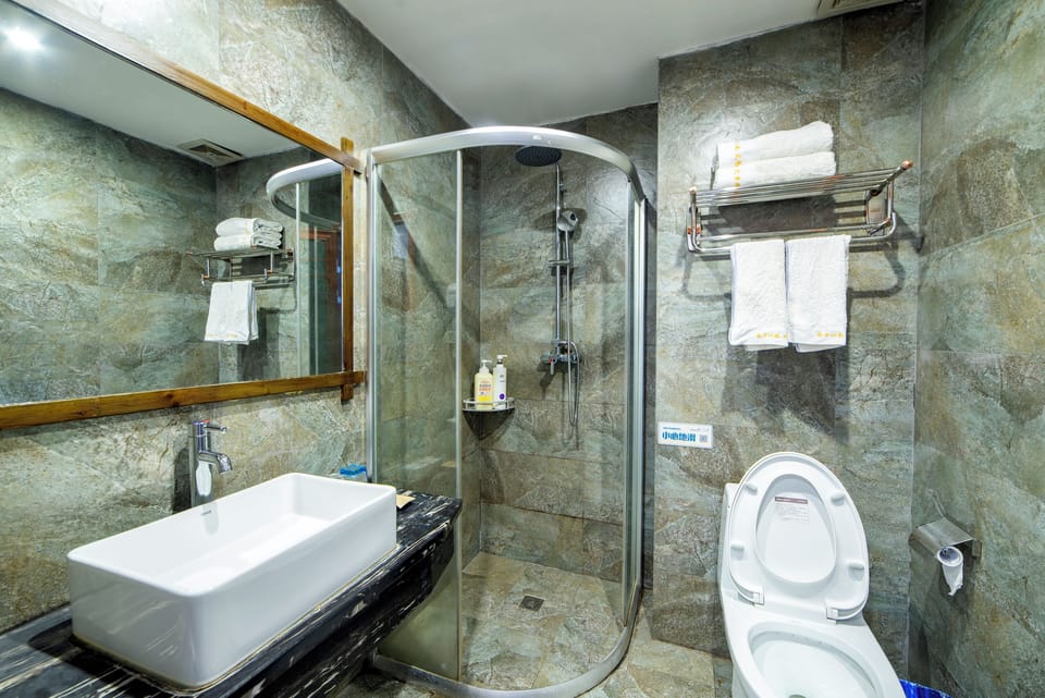 Shower, eco-friendly toiletries, hair dryer, slippers