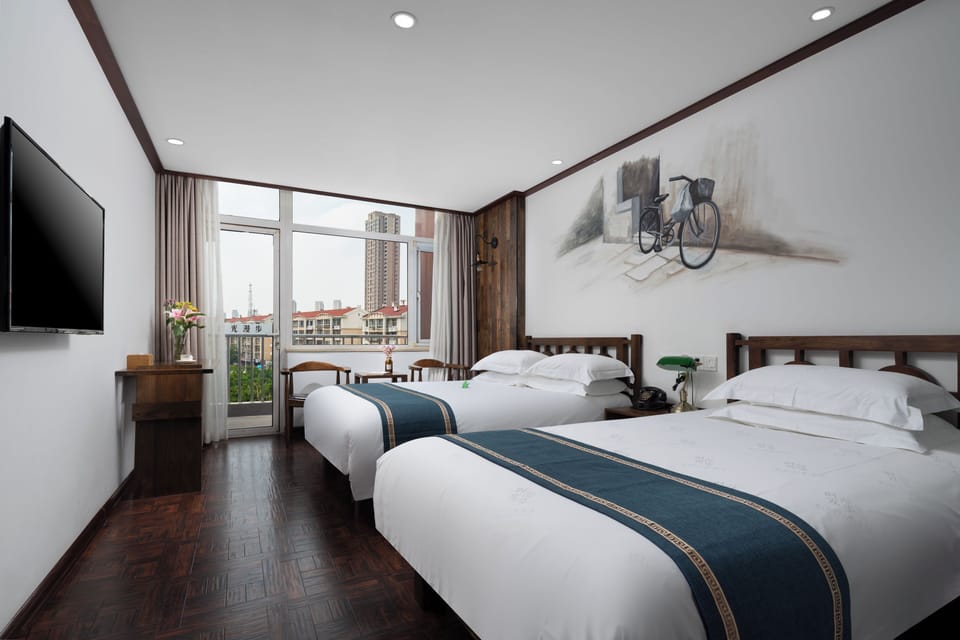 Family Triple Room | Premium bedding, desk, laptop workspace, blackout drapes