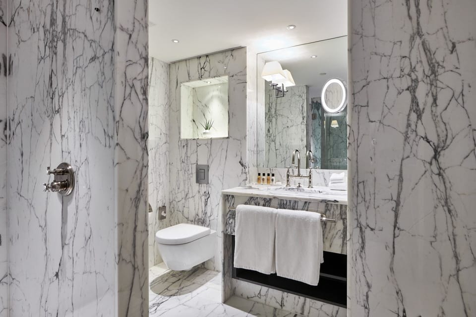 Designer toiletries, hair dryer, bathrobes, slippers