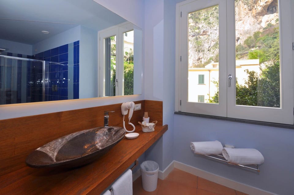 Superior Triple Room, 1 Bedroom | Bathroom | Shower, deep soaking tub, free toiletries, hair dryer