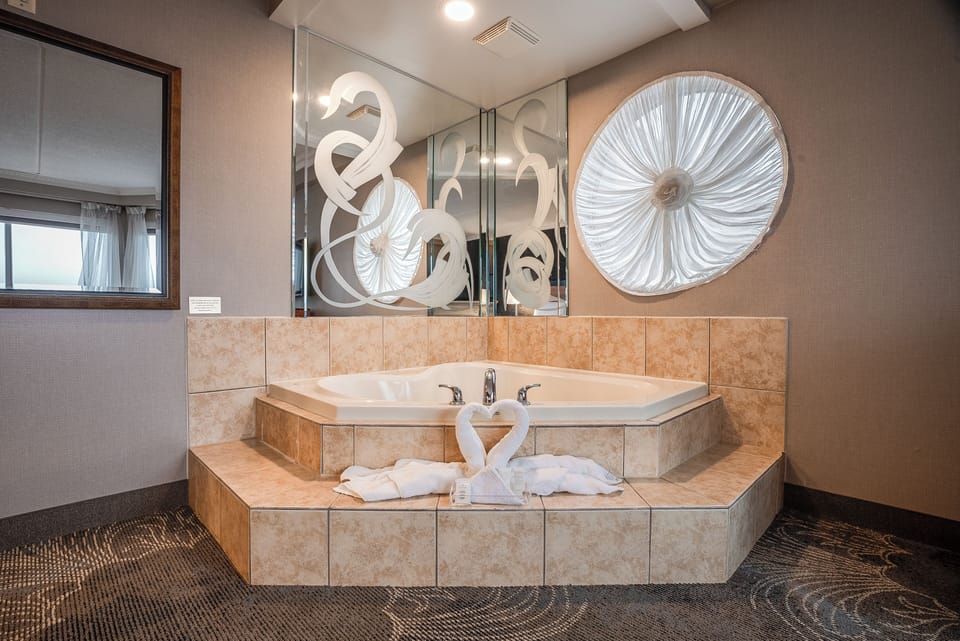 Queen Suite with Jetted Tub | Down comforters, in-room safe, desk, blackout drapes