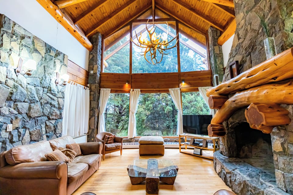 Deluxe Chalet, 5 Bedrooms, Mountain View | Living area | 55-inch LED TV with satellite channels, TV, fireplace