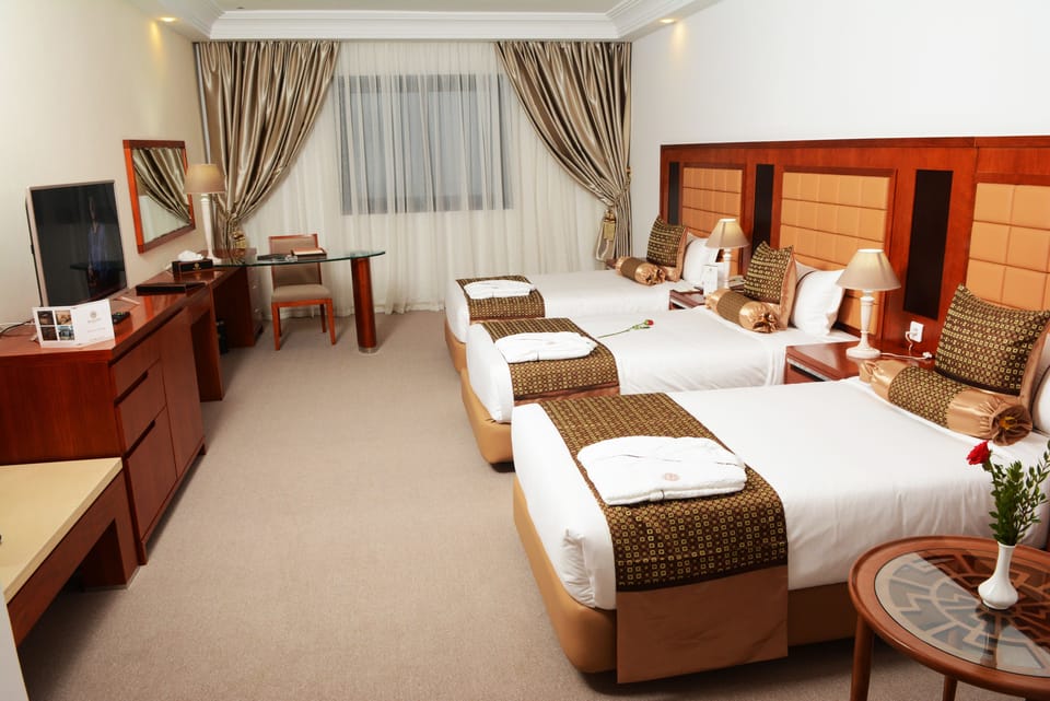 Deluxe Triple Room | 1 bedroom, minibar, in-room safe, desk