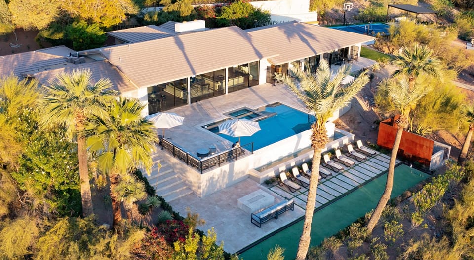 An oasis of elegance nestled in the Arizona hillside, offers unmatched privacy, a resort-style pool, and expansive outdoor living spaces, all framed by breathtaking desert and mountain views. A perfect blend of serenity and sophistication.