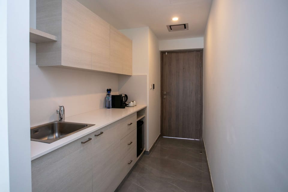 Suite, 1 King Bed, Non Smoking (Living Room;with Sofabed) | Private kitchen | Espresso maker, coffee/tea maker, electric kettle, highchair