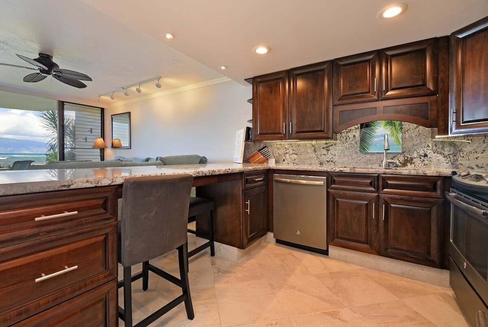 Spacious countertop and bar seating make this kitchen perfect for casual dining and entertaining.