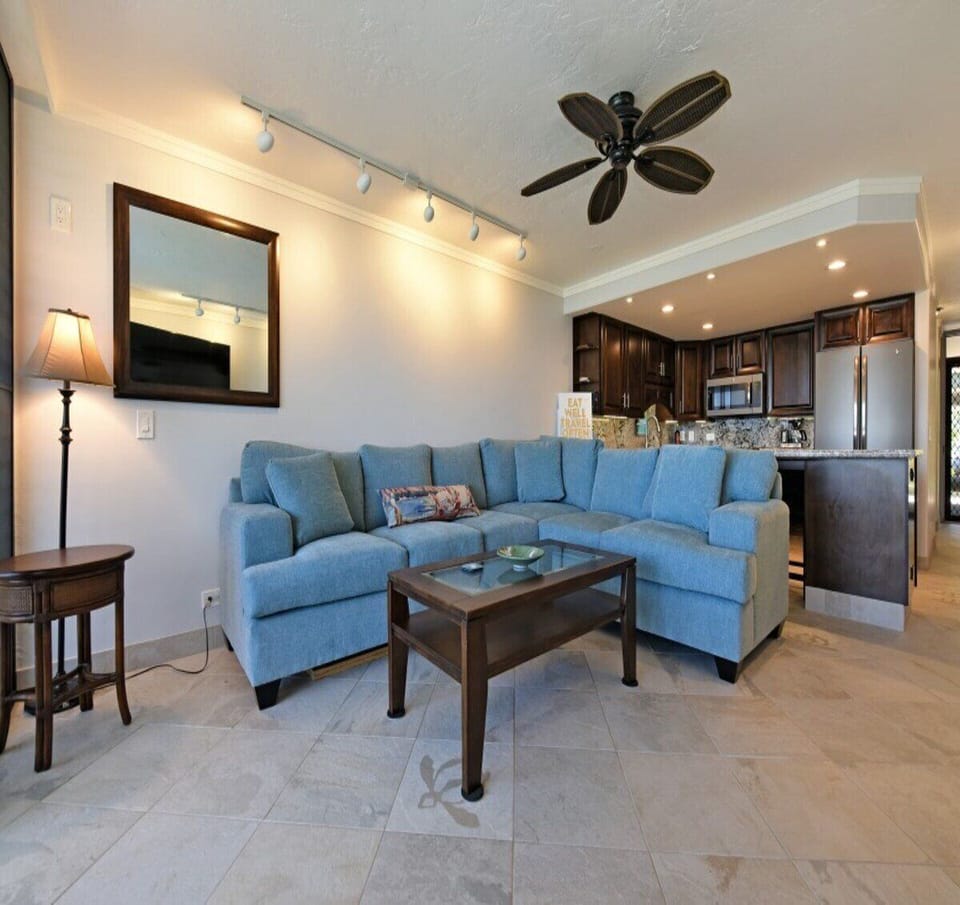 Comfortable sectional sofa with stylish decor and easy access to the kitchen for a seamless stay