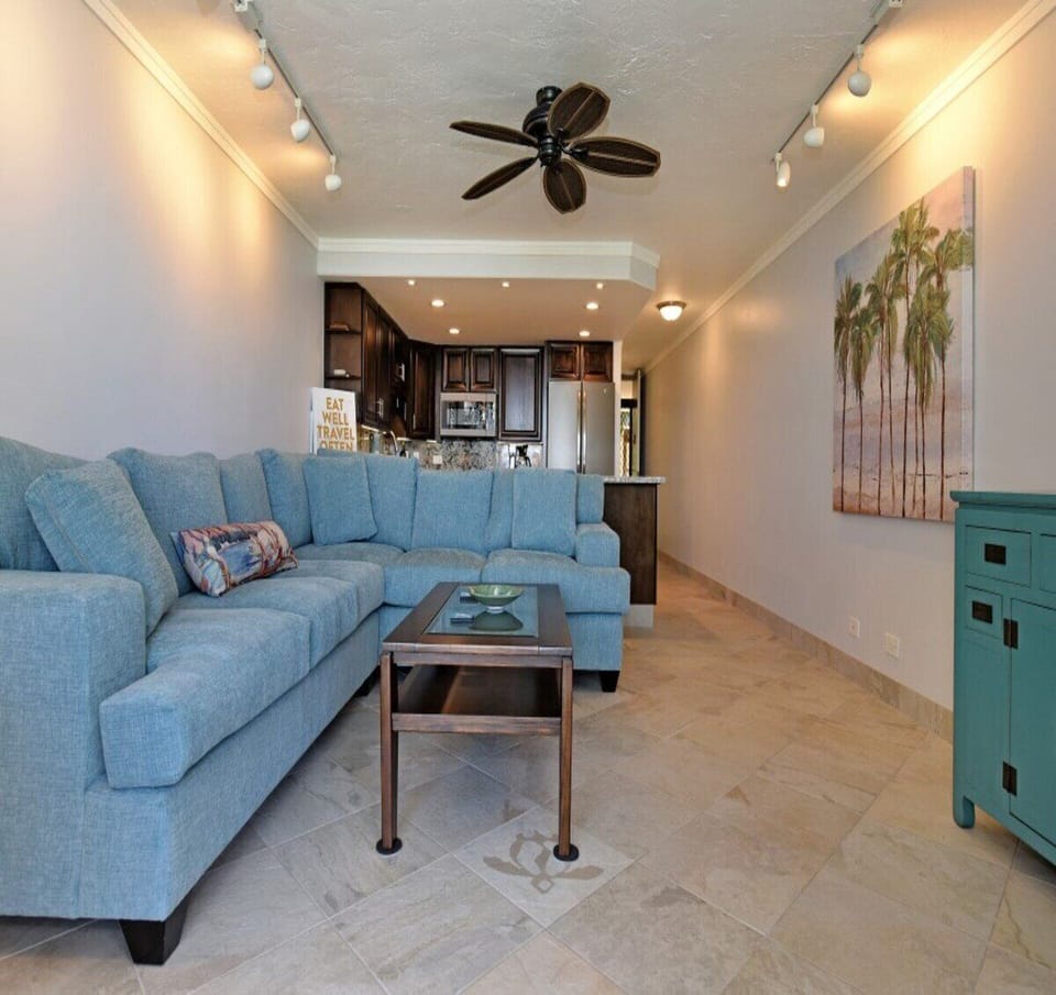Comfortable sectional sofa and chic furnishings create a relaxing space for family and friends