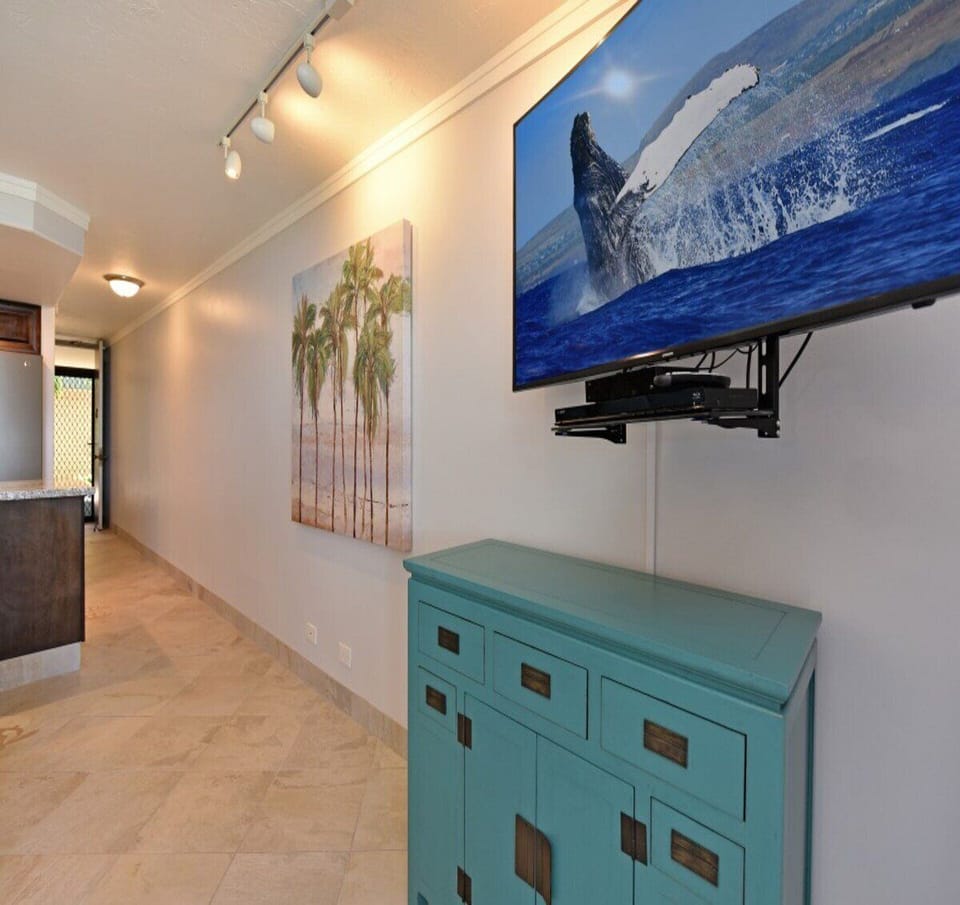 Enjoy your favorite programs in a cozy setting with tropical-inspired decor