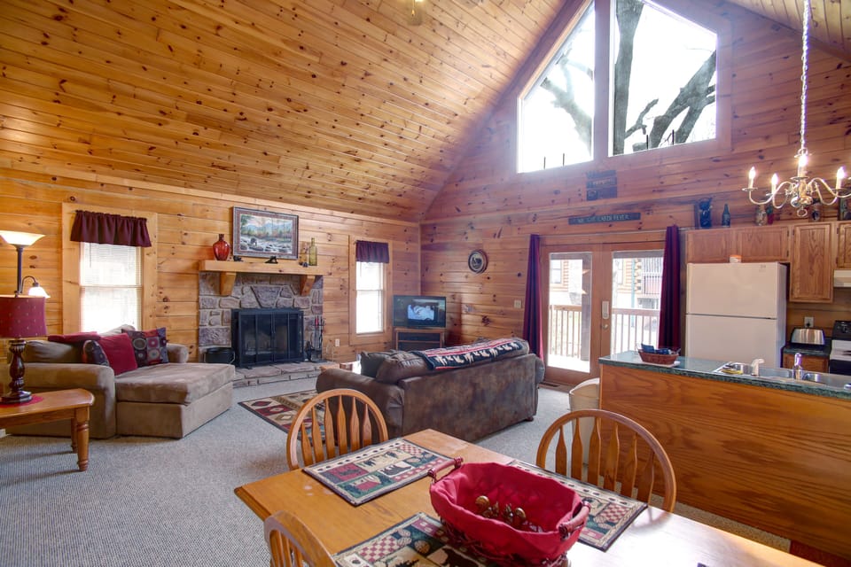 Bright comfortable Great Room with sleeper sofa, fireplace and flatscreen TV