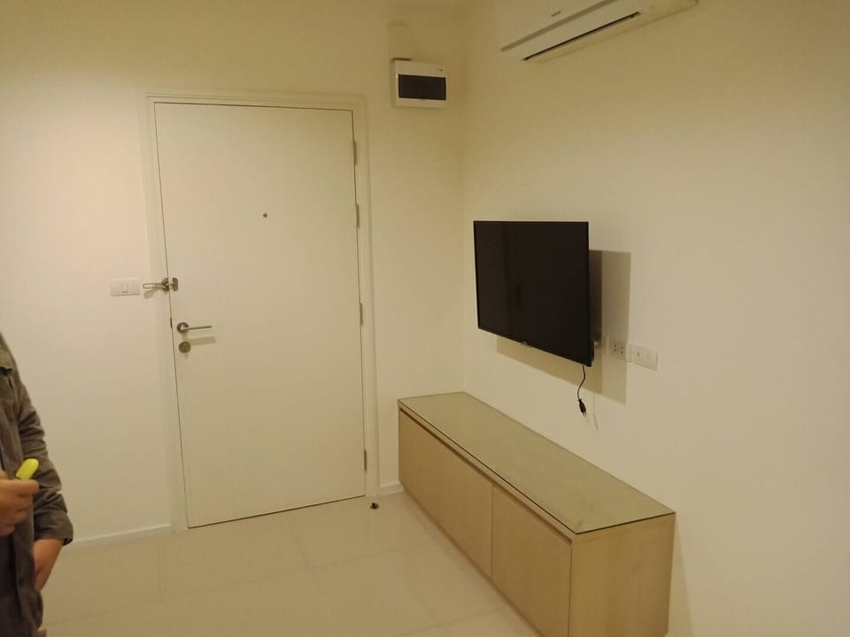 One Bedroom Condo with Balcony  | Living area | Flat-screen TV