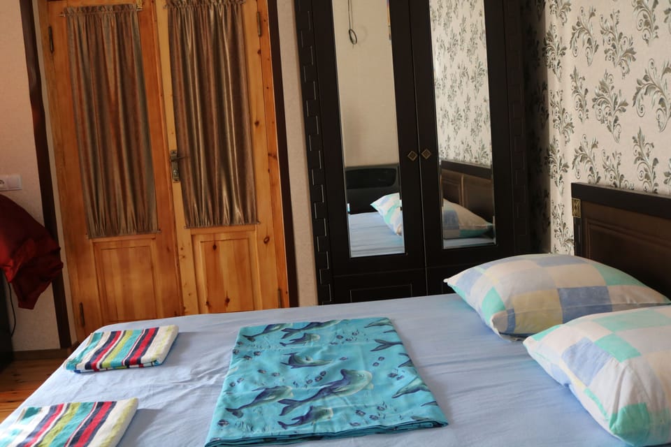 Family Triple Room, Garden Area | Iron/ironing board, free WiFi, bed sheets