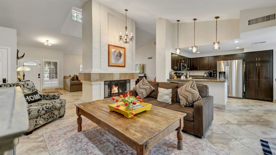 Cozy family room with two-way fireplace, television 