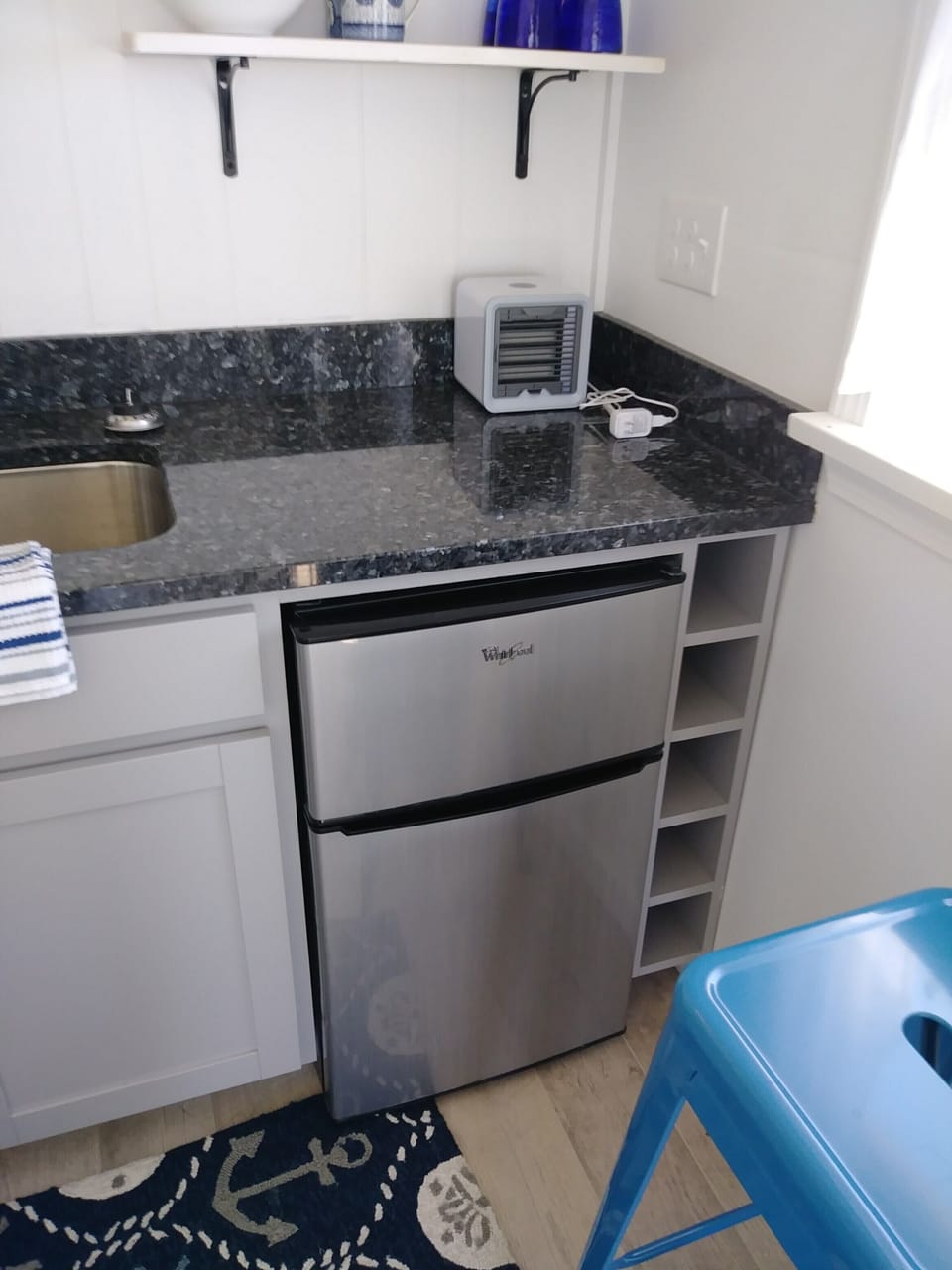Small refrigerator and freezer.  Freezer can hold a gallon of ice cream.  