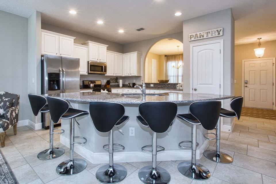 Kitchen equipped with dishwasher, microwave, stove, blender, mixer, toaster, coffee maker and all necessary utensils.