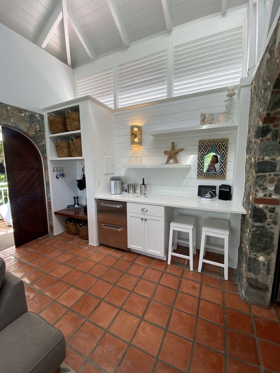 The great room has a bar area with 2-drawer refrigerator for the barkeeper!