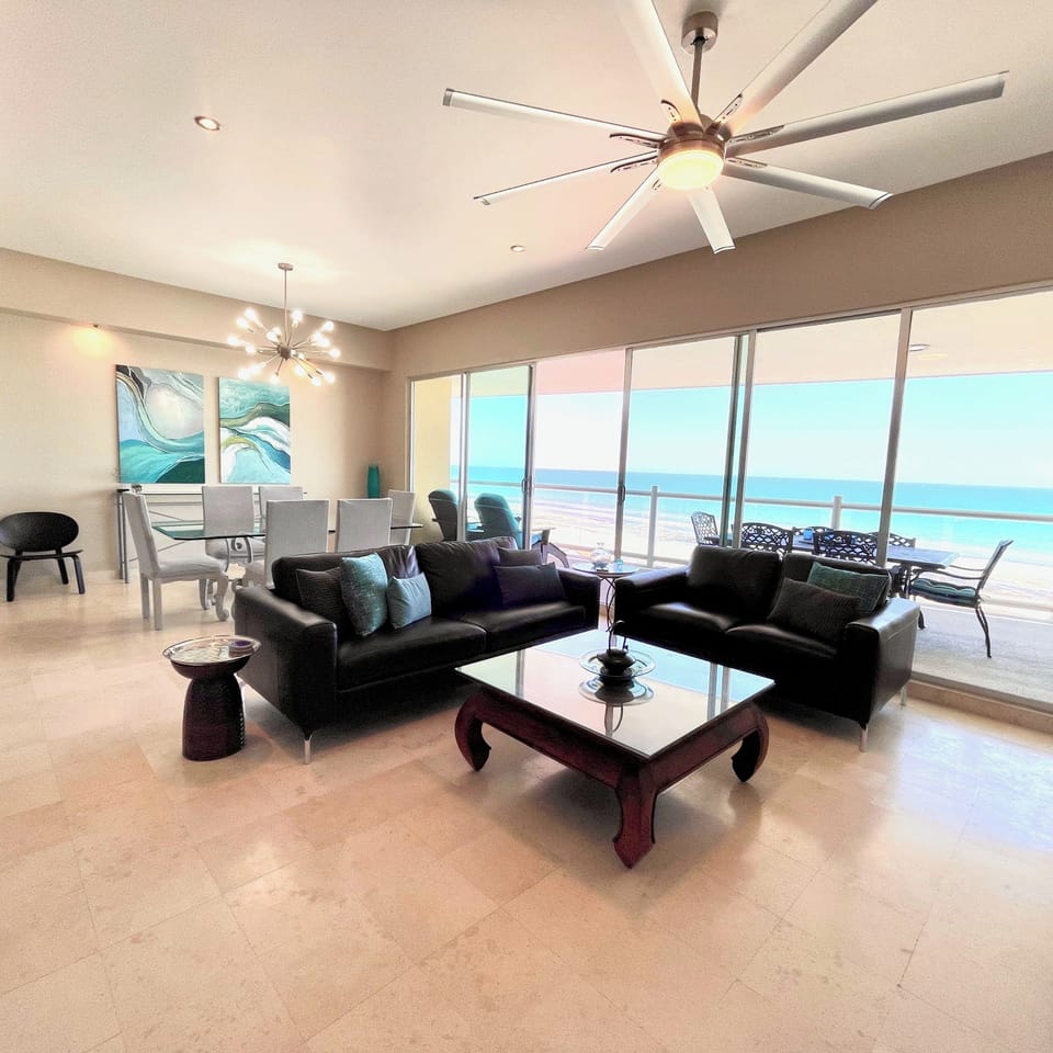View as you enter the condo with expansive balcony and endless views of the sea.