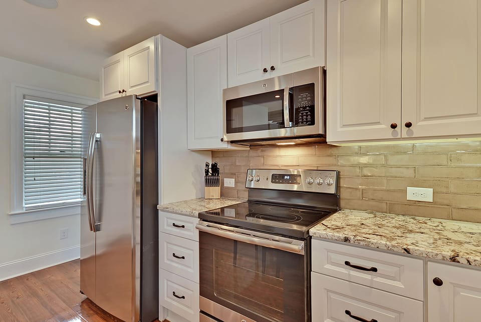 Full size refrigerator with ice maker and water dispenser