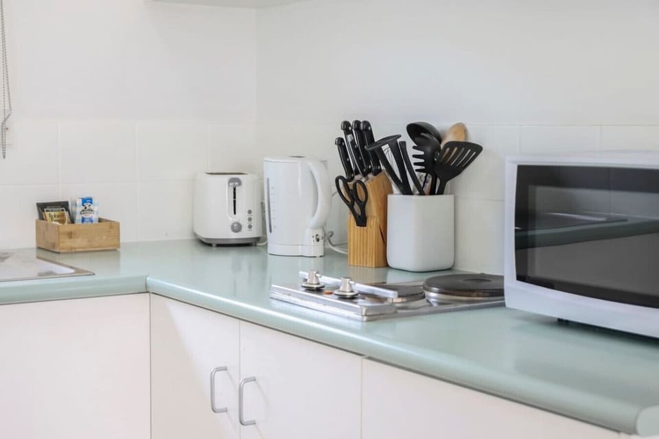 Fully equipped kitchenette with kettle, toaster and everyday cooking essentials.