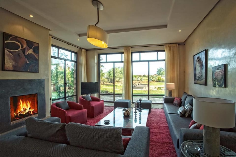 Luxury Villa, Golf View (5 Suites Luxe) | Living room | 32-inch LCD TV with satellite channels, TV, fireplace