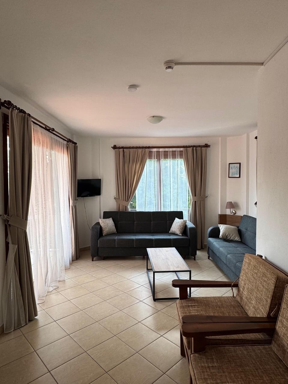 Quadruple Room, River View | Living area | LCD TV
