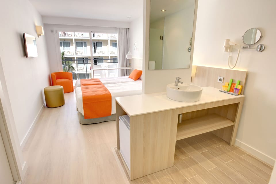 Shower, designer toiletries, hair dryer, towels