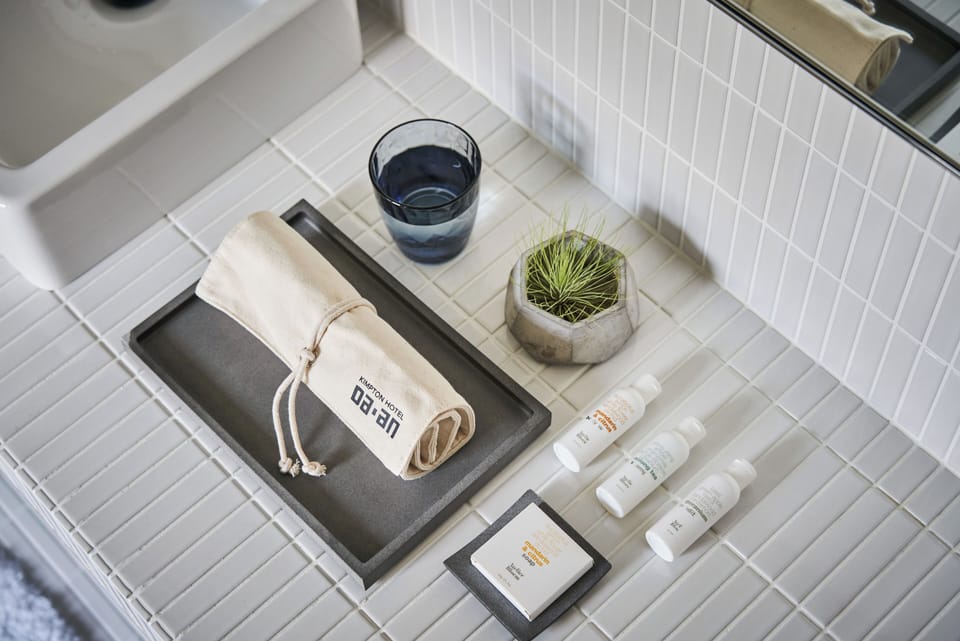 Designer toiletries, hair dryer, bathrobes, slippers