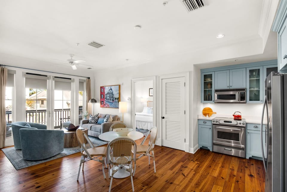 Bright, airy living room with cozy seating and hardwood floors