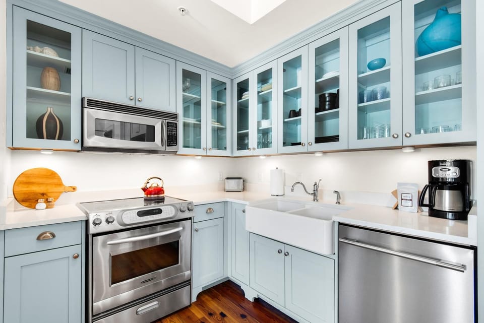 Bright, airy kitchen with modern appliances and farmhouse sink