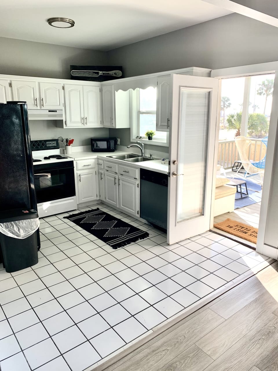 Fully stocked, open kitchen with connection to back balcony door.