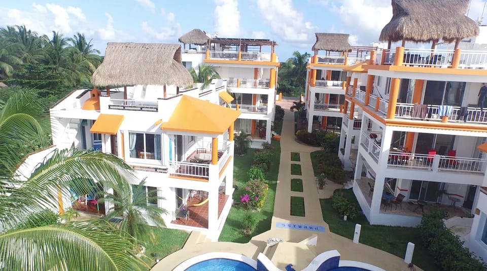The First building on the left 2 steps from the pool is the Beach House