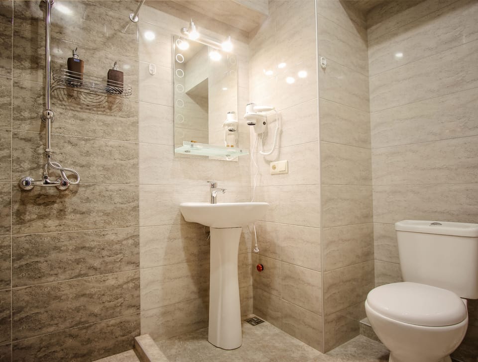 Shower, hair dryer, slippers, towels