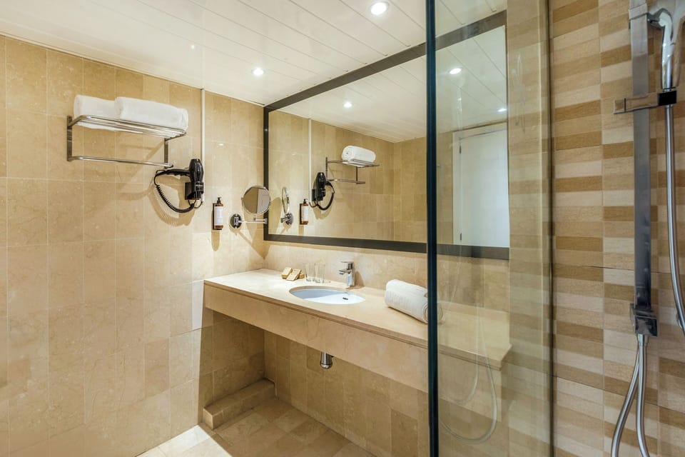 Shower, free toiletries, hair dryer, towels