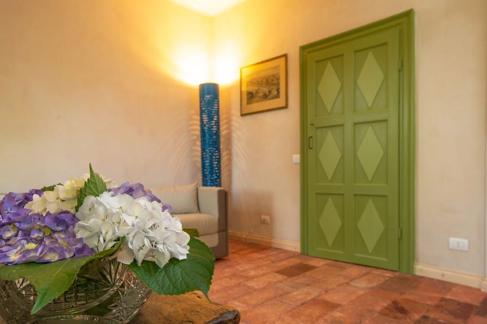 Deluxe Quadruple Room, 1 Bedroom, Lake View | Living area | Flat-screen TV