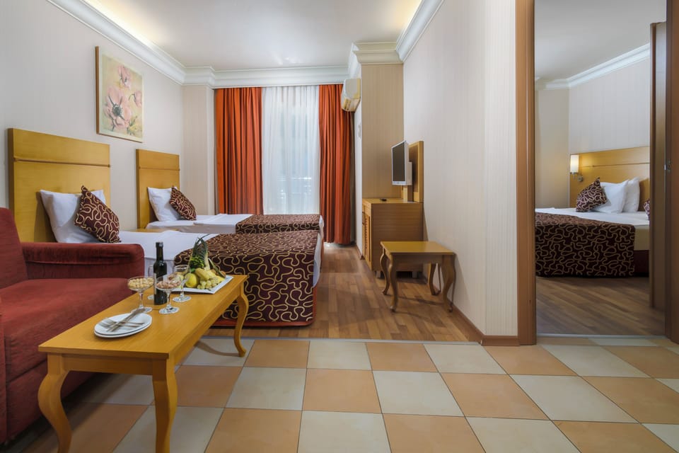 Family Room | Minibar (free items), in-room safe, soundproofing, WiFi (free)