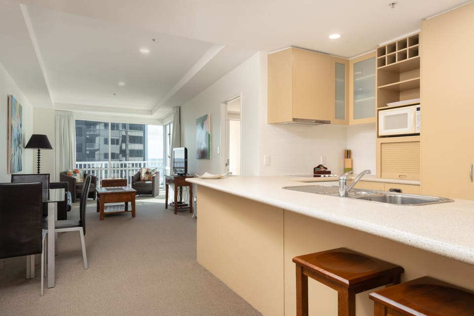 One Bedroom Ocean View Apartments | Living area | Flat-screen TV