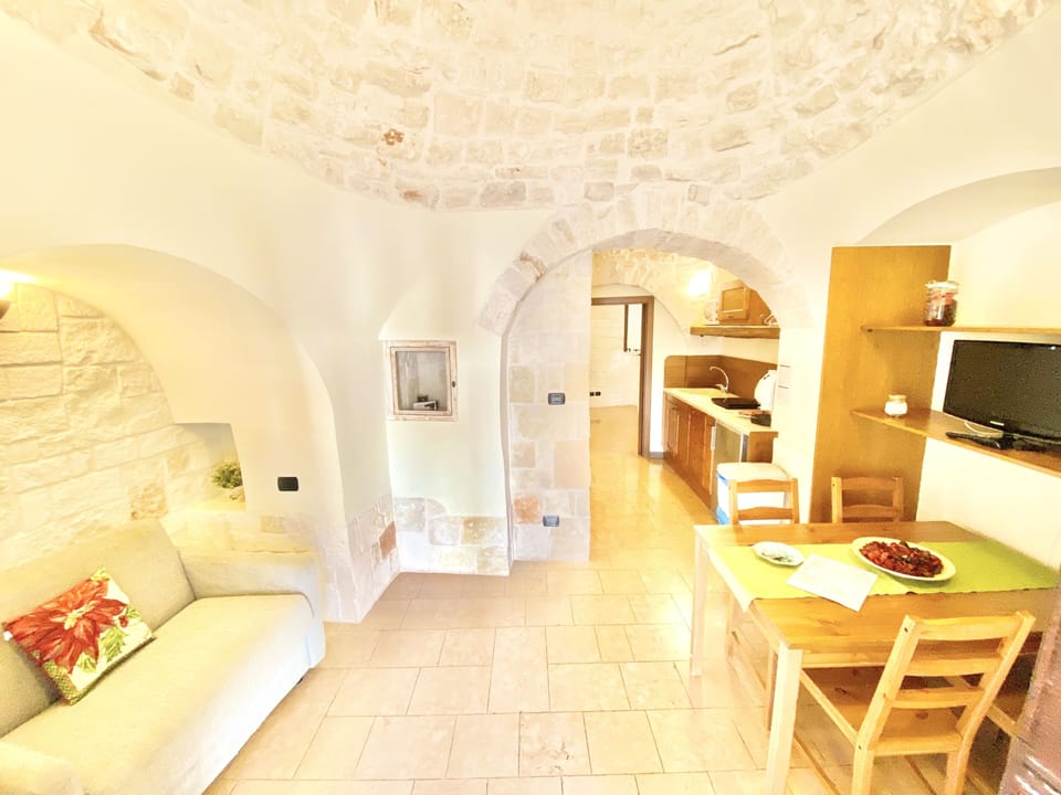 Suite, 2 Bedrooms, Bathtub (Trullo Iris) | Living area | 32-inch LCD TV with digital channels