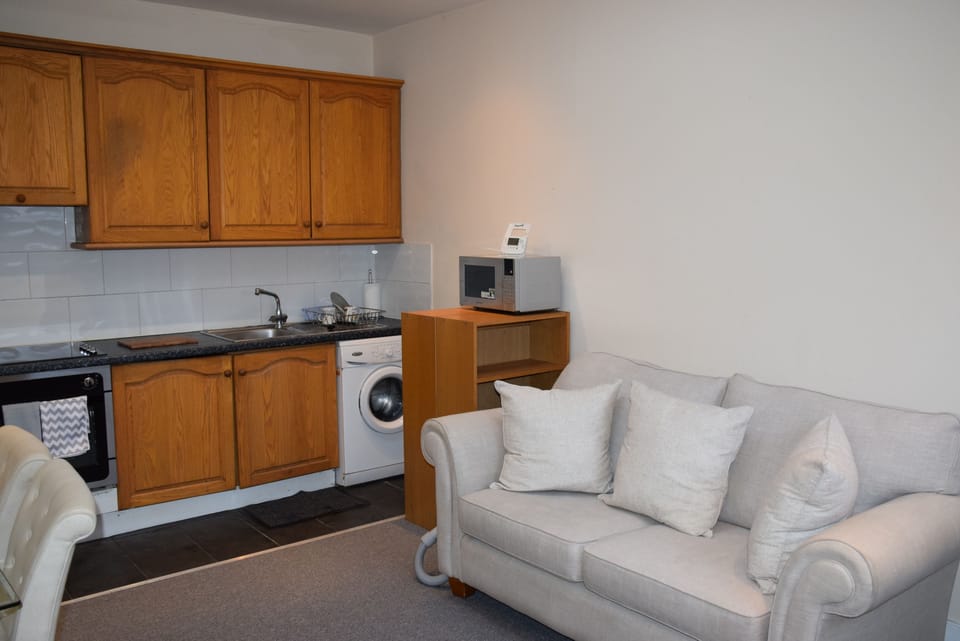 Deluxe Apartment, 2 Bedrooms | Living area | Flat-screen TV