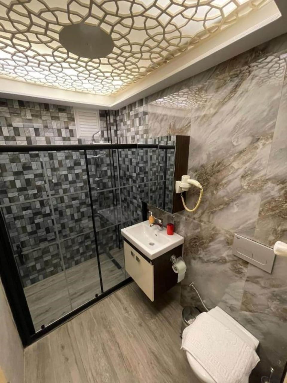 Shower, free toiletries, hair dryer, slippers