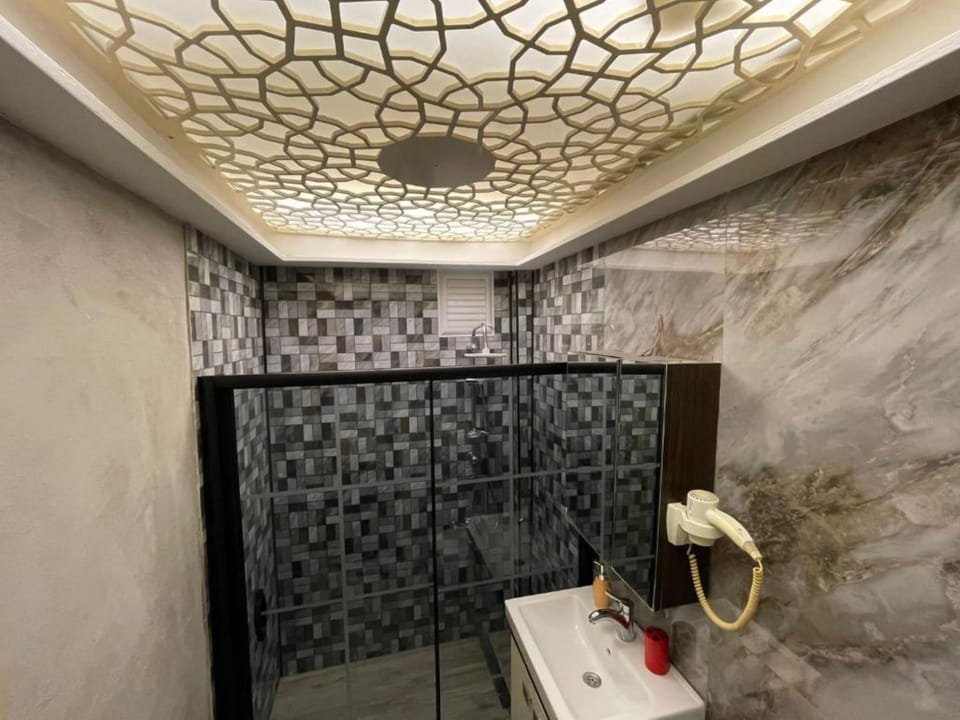 Shower, free toiletries, hair dryer, slippers