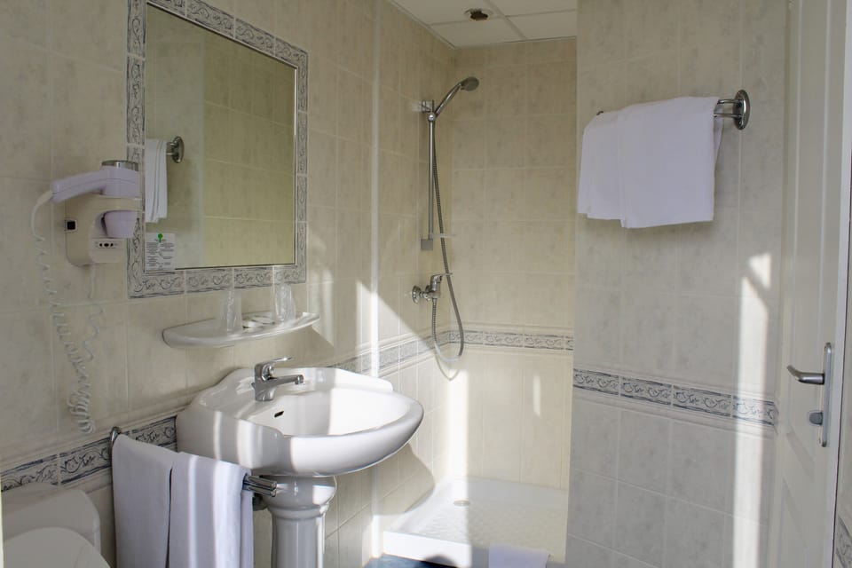 Shower, free toiletries, hair dryer, towels
