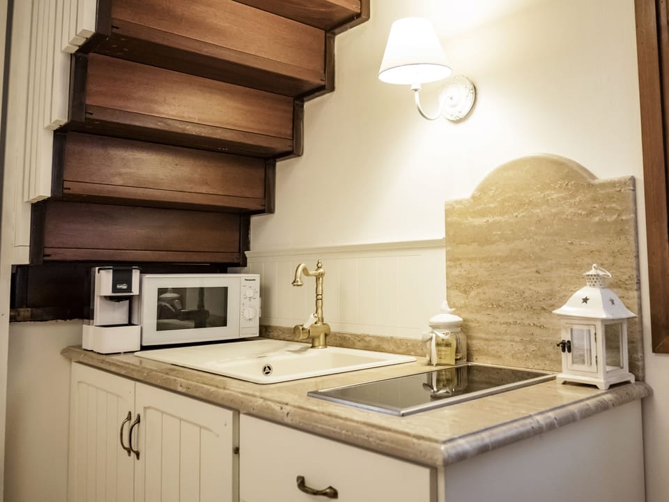 Fridge, stovetop, espresso maker, coffee/tea maker