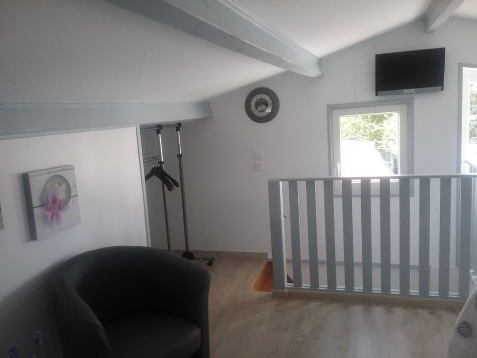 Standard Duplex, Balcony | Living area | Flat-screen TV