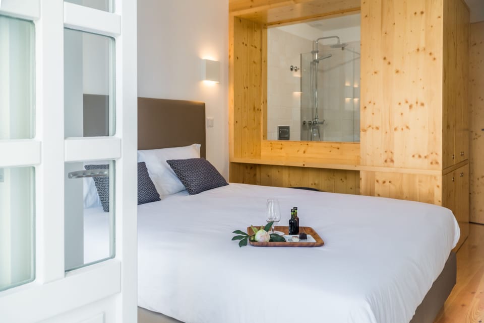 Deluxe Double Room, Balcony, River View | Minibar, in-room safe, desk, blackout drapes
