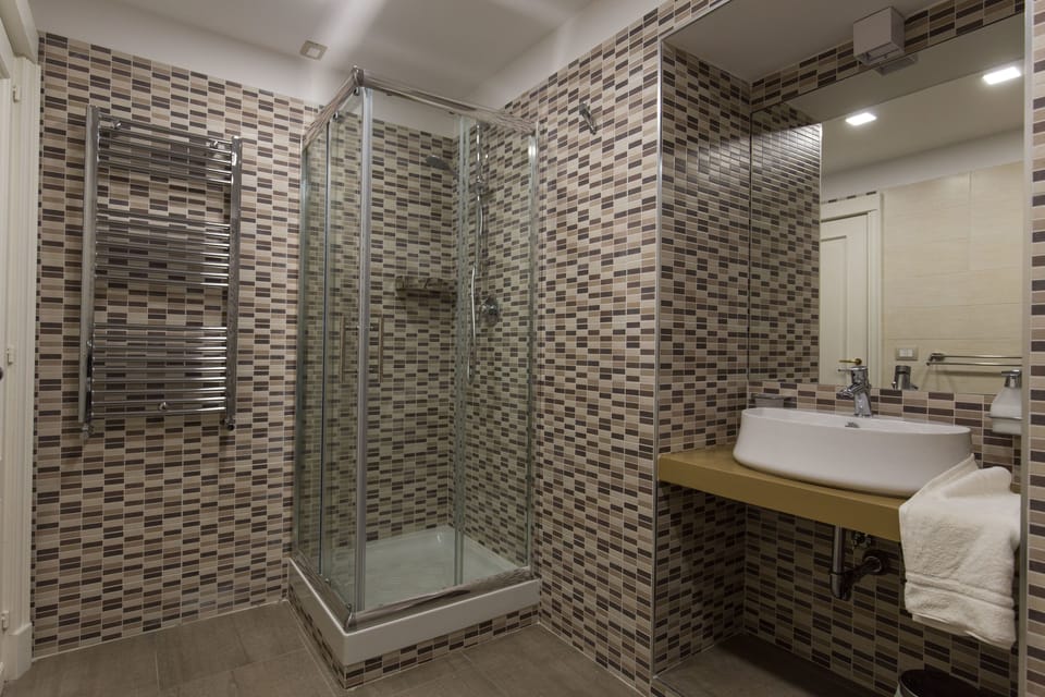 Exclusive Double Room, 1 Queen Bed with Sofa bed | Bathroom | Shower, free toiletries, hair dryer, bathrobes
