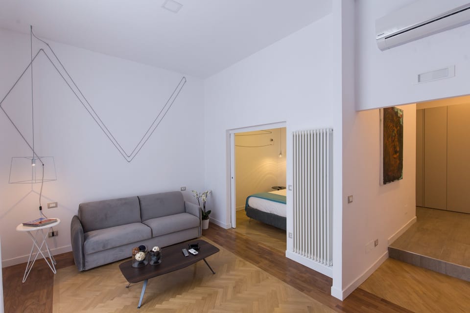 Luxury Suite, City View | Living area | 40-inch flat-screen TV with digital channels, TV