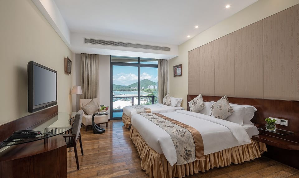 Family Sea View Room | Minibar, in-room safe, desk, blackout drapes